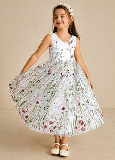 In a trendy maxi length, this eye-catching flower girl dress is ideal for spring and summer celebrations. Topped with decorative embroidery, this pretty dress is a true stand-out. The sleeveless bodice has an alluring V-neckline while the A-line skirt streams gracefully to the floor. Lace Tulle Dress, Decorative Embroidery, Ivory Flower Girl, Ivory Flower Girl Dresses, Tulle Flower Girl, White Flower Girl Dresses, Flower Girl Dresses Tulle, Summer Celebration, Dress Flower