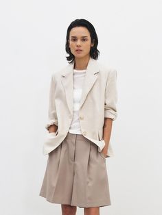 This is a minimal and feminine blazer by MOHAN that is made out of high quality and sturdy fabric. With design detail that gives a trendy and refined mood, you can style it with various items for a clean daily outfit. - Cool and light touch of linen and cotton blend fabric- Half length lining with vapor permeability- Padding on the shoulder Classic Linen Blazer For Office, Classic Linen Office Blazer, Chic Structured Blazer With Hidden Button Closure, Notch Lapel Blazer For Spring Workwear, Chic Structured Notch Lapel Blazer, Chic Structured Blazer With Pressed Crease, Chic Structured Blazer For Work, Chic Single-breasted Structured Blazer, Chic Structured Single Breasted Blazer