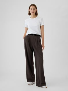 Soft, warm brushed twill trousers.  E-waist with concealed hook and bar closure, zip fly.  Front slant pockets, back welt pockets.  Pleating at front.  Fit: Classic.  An easy silhouette that fits close at the waist, and is relaxed through the hips and thigh.  Models wearing Gap Trousers Outfit Winter, Brown Trousers Outfit, Cotton Trousers Women, Fw 2024, Fall Winter Capsule Wardrobe, Easy Silhouette, Work Fits, Trouser Outfit, Brown Trousers