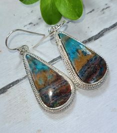 "Natural Rare AAA Grade Blue Opalized  Petrified Wood Handmade .925 Sterling Silver Earrings 12.6 Grams 1 7/8\" x 5/8\" FG02 Gift for Her Genuine Stones Gift for Her Genuine Stones! -A rare fragment from a recently-discovered vein of opal on the slopes of an Indonesian volcano, this stone formed when opaline silica flows formed in place of an ancient petrified forest. It's said to enhance imagination, creativity, and spontaneity.  All of our items are one of a kind and hand crafted.   These stones are beautiful and are thousands of years old but only discovered a few years ago. We hand pick our stones from all over the world. Each item is handcrafted and one of a kind item.  The silver is very study and not flimsy like some sellers.  We guarantee all item to be sterling silver. We ship all Artisan Drop Earrings, Artisan Polished Earrings For Gift, Unique Teardrop Hallmarked Earrings, Unique Hallmarked Teardrop Earrings, Blue Opal Earrings, Petrified Forest, Southwest Jewelry, Petrified Wood, Opal Earrings