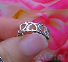 Hearts Love Sterling silver ring sizes 4-11 SOLID sterling stamped 925 silver Tarnish free 4 5 6 7 8 9 10 11 *IF YOUR SIZE ISNT SHOWING, MESSAGE ME. I might be sold out and will be able to replenish shortly* Top of ring height: 6.2mm Band width: 3mm Shank width: 2.4mm This is a High Polished solid sterling silver ring with Rhodium plating to prevent tarnishing. Nothing but the best from my custom jewelry store. --------------------------- Please follow care instructions. Any rings with stones, r Silver Heart Ring For Mother's Day Promise, Nickel-free Heart Ring For Valentine's Day, Nickel-free Sterling Silver Rings For Valentine's Day, Nickel Free Heart Shaped Anniversary Rings, Nickel-free Heart Ring For Anniversary, Nickel-free Heart Shaped Anniversary Rings, Sterling Silver Heart Ring For Mother's Day Promise, Sterling Silver Open Heart Rings For Mother's Day, Adjustable Silver Heart Ring For Mother's Day