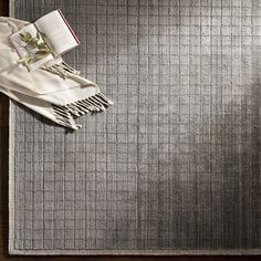 an open book laying on top of a rug