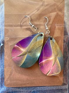 These beautiful earrings have been sublimated on both sides with the same design. No worries that one earring may flip direction and no longer match.  These earrings feature various shades of pinks, teals and purple along a brilliant glittering contrast One Earring, All That Glitters, Teardrop Earrings, Beautiful Earrings, No Worries, Jewelry Earrings Dangle, Etsy Earrings, Dangle Earrings, Jewelry Earrings