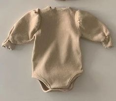 Wrap your little one in cozy comfort with our Long-Sleeved Ribbed Onesie. Made from soft and breathable cotton, this unisex onesie is perfect for babies aged 6 to 24 months. The O-neck collar and solid pattern add a touch of style, while the long sleeves provide extra warmth during the winter season. Crafted with your baby's comfort in mind, this onesie is a must-have for any parent. 🌟👶 #BabyEssentials #CozyComfort Specifications: Material: Cotton Gender: Unisex Item Type: Onesie Age Range: 6– Unisex Onesies, Long Romper, Custom Size Dresses, Bubble Sleeve, Baby Comforter, 2nd Baby, Girls Rompers, Long Sleeve Romper