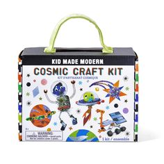 a box with some stickers on it and a bag in the front that says,'kid made modern cosmic craft kit '