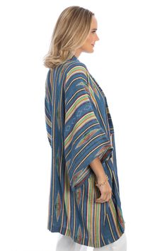 The long silhouette of our colorful Aztec-inspired kimono is comfy and breathable. As an added bonus, this piece has two deep pockets on either side. Materials: 100% Cotton Size: 27” x 44” Made In India Multicolor Summer Outerwear With Pockets, Multicolor Relaxed Fit Outerwear With Pockets, Relaxed Fit Multicolor Outerwear With Pockets, Oversized Blue Cardigan With Pockets, Multicolor Long Outerwear For Vacation, Long Multicolor Outerwear For Vacation, Oversized Long Blue Outerwear, Beach Outerwear With Kimono Sleeves In Multicolor, Blue Long Cotton Outerwear