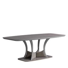 a table that is made out of concrete and has an oval shaped base with curved edges