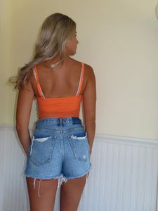 Orange Festival Crop top Orange Stretch Crop Top, Stretch Orange Cropped Top, Trendy Summer Tops For Music Festival, Spring Orange Cropped Crop Top, Orange Cropped Top For Beach, Orange Cropped Tops For Vacation, Stretch Orange Tank Top For Summer, Trendy Summer Tank Top For Music Festival, Trendy Tank Top For Summer Music Festival