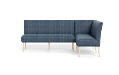 a blue couch sitting on top of a white floor next to a wooden leg chair