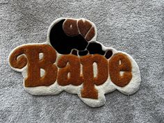 a patch with the word bape on it