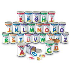 the alphabet and numbers are in tins with different letters on them, including one for each letter