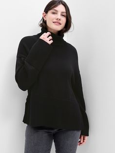 Soft cotton knit. Dropped shoulder, long sleeves with ribbed, banded cuffs. Turtleneck. Slits at ribbed, banded hem. #741497 Turtleneck Tunic Sweater, Black Turtle Neck, Turtleneck Tunic, Turtleneck Sweatshirt, Striped Turtleneck, Tunic Sweater, Split Hem, Cotton Knit, Turtleneck Sweater