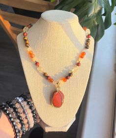 This piece is a gorgeous mix of red jasper, carnelian, citrine, and tigers eye. It is super warming and fun, flashing in the sunlight! Made with genuine gemstones and a hand wire wrapped red jasper pendant, this necklace is full of healing energy.  Made with stainless steel findings and hardware as well as tarnish resistant wire. Secured with a lobster clasp, this piece is 18 inches and adjustable to 22 inches in length. The pendant is 2x1 inches.  *handmade *one of a kind  *ships 3-5 days Red Natural Stones Jewelry For Healing, Red Gemstone Beaded Necklaces For Spiritual Purposes, Red Gemstone Crystal Necklace For Healing, Amber Crystal Necklace With Natural Stones For Healing, Amber Crystal Necklace For Meditation With Natural Stones, Unique Amber Carnelian Beaded Necklaces, Red Spiritual Crystal Necklace With Natural Stones, Spiritual Orange Necklaces With Natural Stones, Spiritual Carnelian Jewelry For Meditation