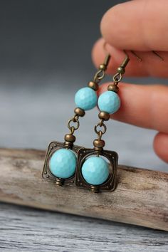 These beautiful boho earrings was made of light blue faceted turquoise paste stone 10 and 8 mm beads, tiny bronze tone czech glass beads-separators, antique square charm-connectors and brass earrings hooks. Earrings hooks are from nickel free and lead free metal. Perfec for everyday wear a great gift for someone special! *The total lenght of earrings is about 57 mm including earring hooks. What is the turquoise paste? The turquoise paste is artificially created in the laboratory by mixing the tu Turquoise Beaded Earrings With Czech Glass, Unique Turquoise Earrings With Czech Glass, Turquoise Czech Glass Dangling Beads Earrings, Turquoise Czech Glass Dangling Earrings, Czech Beads Jewelry, Nature-inspired Turquoise Dangle Earrings, Wire Jewelry Earrings, Beaded Earrings Patterns, Square Earrings