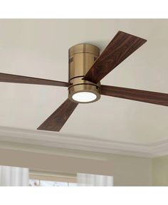 a ceiling fan with two wooden blades and a light on the top one is gold