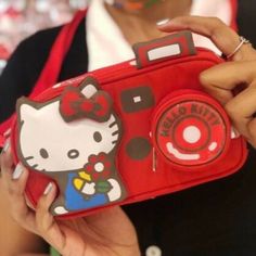 Picture Yourself In This Supercute Hello Kitty Camera Bag! Made In Collaboration With Our Friends Le Sportsac To Celebrate Hello Kitty's 45th Anniversary, This Product Is Limited Edition. 3.75" H X 7" W X 2" Features A Zip Top Main Closure, Exterior Front Coin Pocket With Zip Closure, And Interior Back Wall Open Pocket. There Are Also Two Strap Options: Attached 14" Short Strap, Plus A 40" Long Extension Strap With Quick Release Clips On Each End (For Crossbody Wear). Hello Kitty Camera, Long Extensions, 45th Anniversary, Wall Opening, Zip Top, Quick Release, Camera Bag, Diaper Bag, Red White