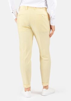 Crafted with a vibrant, cream yellow stretch cotton, these custom made pants are uniquely stylish and supremely comfortable, and will become a go to favorite when you're looking to stand out. Fitted High-waisted Summer Chinos, Chic Fitted Cotton Chinos, Fitted Tapered Leg Summer Chinos, Fitted Cream Cotton Pants, Cream Stretch Cotton Pants, Stretch Cotton Cream Pants, Chic Yellow Tapered Leg Pants, Chic Yellow Tapered Pants, Yellow Stretch Tapered Leg Bottoms