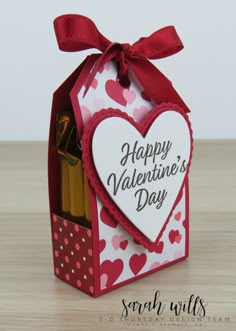 a valentine's day card in a box with pencils and erasers inside