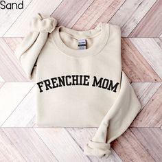 Explore our delightful collection of Frenchie-themed apparel, including cozy sweatshirts, trendy crewnecks, and charming tees perfect for any French Bulldog enthusiast. Find the ideal gift for a proud Frenchie mom or a special treat for yourself. Express your love for these adorable companions with our unique and funny designs that celebrate the bond between dogs and their owners. Embrace the joy of being a French Bulldog parent with our exclusive French Bulldog shirts - where style meets dog lo Bulldog Sweatshirt, French Bulldog Shirt, Mom Crewneck, Frenchie Mom, Bulldog Shirt, Cozy Sweatshirts, Shirt Ideas, Sizing Chart, Dog Love