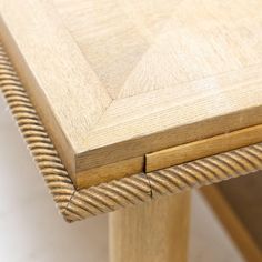 a close up view of a wooden table with lines on it's edge and bottom