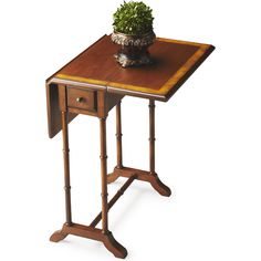 a small wooden table with a potted plant on it's top and legs