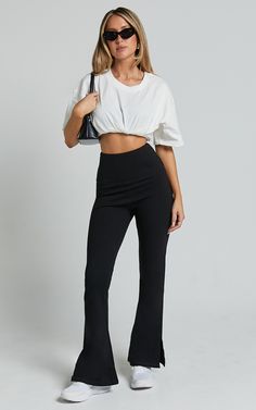 Step up your style game with our Beau Pants. These high-waisted, full-length skinny leg pants are the perfect addition to your casual wardrobe. Made from a comfortable and lightweight rayon fabric, these black pants will effortlessly elevate any outfit. The split hem adds a trendy touch while allowing for easy movement. Whether you're heading to brunch or a night out with friends, these versatile Beau Pants have got you covered. Embrace your individuality and show off your fierce fashion sense i Versatile High-waisted Stretch Pants, High-waisted Elastane Leggings, Chic Black Elastane Yoga Pants, Versatile High Stretch Ankle-length Pants, Stylish Black Yoga Pants, Versatile Wide Leg Black Leggings, Versatile Black Wide Leg Leggings, Casual High Stretch Straight Pants, Chic Stretch Yoga Pants Straight Style