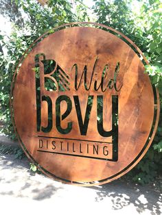 a metal sign that says wild bevy distilling