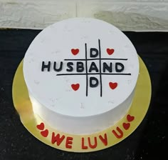 a cake with the words husband and we luv u on it is sitting on a table