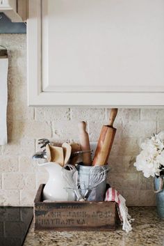 the kitchen counter is clean and ready to be used as a storage container for cooking utensils