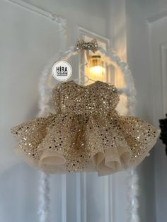 "Gold Sequin Ribbon Baby Girl Wedding Dress"  Make your little angel sparkle on her special day! ✨✨ Dress her up in this stunning Gold Sequin Baby Ribbon Girl Wedding Dress and watch her shine like a star!  ✨ Features: 🌟 Shimmering gold sequins for a glamorous look 👗 Soft and comfortable fabric for all-day wear 🎀 Delicate bow detailing for an adorable touch 💫 Fluffy tulle skirt for a princess-like feel Whether she's a flower girl or attending a wedding, this magical dress will make her the c Babies Frocks, Gold Baby Dress, Princess Style Dress, Girl Wedding Dress, Magical Dress, Puffy Dresses, Kids Gown, Pearl Stone