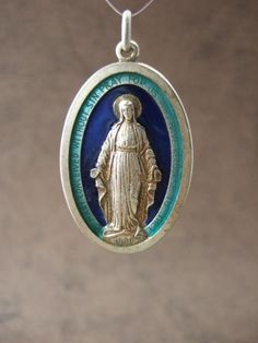 Large Vintage Catholic Miraculous Medal with 2 tone blue enamel (NOS) This beautiful medal measures 26x42mm or 1 1/2 tall. Its quite large and heavy in weight. The front is a very detailed image of the Virgin Mary. There are 2 different colors of blue enamel around her. Around the edge is the The Virgin Mary, Miraculous Medal, Mother Mary, Religious Art, Virgin Mary, Detailed Image, Collectable Items, Different Colors, Patina