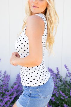 Be all dotted up in this fun and flirty tank! Perfect for summer, this ivory and black scoop neck polka dot top will give you a cute, stylish look and will have you ready to take-on the sunshine! Model Specs: 5'5", 34DD, Size 3, Wearing size Small Fabric: 97% Polyester, 3% Spandex Sizing Recommendations: Small 0/4 Medium 6/8 Large 10/12 Spring Polka Dot Button-up Tops, Polka Dot Button-up Spring Tops, Polka Dot Tank Top, Sleeveless Polka-dotted Cotton Top, Black Dots, Polka Dot Top, Scoop Neck, Dots, Fabric