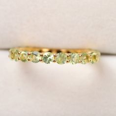 Peridot Eternity Band, natural peridot full eternity band, green gemstone peridot engagement wedding band, full eternity band, peridot Main Stone : Peridot Main Stone Creation: Natural Main Stone Shape: Round Main Stone Color: Green Main stone Birthmonth : August Stone Size : 3 mm Stone Carat Weight : 3.50 Ct ( Approx. ) Jewelry Type: Ring Metal: Silver Method: Cast Personalization: Possible Style: Chevron Ring Size: We make rings from US 3 to US 10. This elegant ring is perfect for any occasion Green Gemstone Eternity Band For Promise, August Stone, Wedding Birds, August Birthstone Ring, Platinum Wedding Band, Chevron Ring, Matching Wedding Bands, Half Eternity Band, Peridot Ring