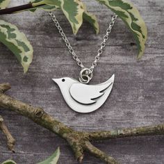 This little bird pendant and it's wing decoration are hand pierced (sawn out) from sterling silver sheet using a fine jewellers saw.   All components are then silver soldered together.   It has been oxidised to enhance features of it's design and has been given a gorgeous matt satin finish.  The bird measures approximately 23.5mm wide by 16mm high (including the jump ring) and is suspended from a lovely sterling silver mini oval belcher chain.  If you would prefer different length necklace or indeed different size bird pendant, please do get in touch to discuss your requirements. Many thanks for visiting.   Please do get in touch if you have any more questions. Fee * A note about hallmarking: By UK law, all sterling silver items for sale weighing 7.78g or over must be hallmarked by one of Silver Bird-shaped Jewelry As Gift, Silver Bird-shaped Jewelry For Gift, Silver Bird Shaped Jewelry For Gifts, Silver Charm Necklace Gift, Bird Design Necklace As A Gift, Bird-shaped Bird-design Necklace For Gifts, Bird Design Necklace Perfect For Gifts, Bird Design Necklace For Gift, Elegant Sterling Silver Necklace With Bird Design