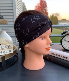 "💜Soft💙Versatile💛Stretchy💚Dental Headbands💜 Soft & Stretchy versatile Headbands measure approximately 4\" wide by approximately 8.5\" long when laid flat.  Original fabric starts out at approximately 20\" in length. Adult/teen sized.  Can be worn several different ways - wear with the top knot in the front for a faux turban look, off to the side or in the back for a wider headband coverage. This cute Black outlined Tooth Headband is the perfect headband for a Dental office.  They make great Stretch Black Headband, Casual Black Headband With Cotton Sweatband, Casual Cotton Headband With Elastic Band, Casual Adjustable Black Headband, Tooth Headband, Blue Headband, Dental Teeth, Stretchy Headbands, Dental Hygienist