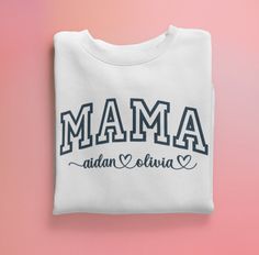 Get cozy with our Custom Mama Embroidered Sweatshirt, the perfect gift for any mom or treat yourself as a proud mama! This stylish sweatshirt is made from premium materials and features exquisite embroidery personalized with your children's names in a beautiful font. The large and comfortable crewneck design ensures a relaxed fit and the high-quality materials ensure durability and longevity. This sweatshirt is the perfect addition to any mom's wardrobe and makes a great gift for any occasion, w Mama Embroidered Sweatshirt, Embroidery Personalized, Mom Wardrobe, Crewneck Design, Kids Names, Personalized Gifts For Mom, Beautiful Fonts, Embroidered Sweatshirt, Embroidered Sweatshirts