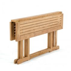 a wooden bench sitting on top of a white floor