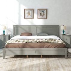 a large bed sitting next to two nightstands on either side of the bed in a bedroom