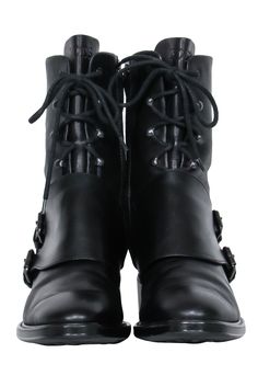 Take on any mission with confidence in Tod's black leather combat boots! With double buckles and lace up fastening, they'll keep you looking sharp and keep your feet firmly on the ground. Strut confidently, paired with a leather jacket and dark wash jeans! Size 8 (EU 38) 100% Leather Lace up front Double buckle side closure Interior zipper closure Heel 1.5" Shaft 7.5" Circumference 10" Toe to heel 11" Black Moto Boots With Front Lace-up Fastening, Leather Lace-up Combat Moto Boots, Black High Ankle Moto Boots With Lace-up Fastening, Gothic Leather Combat Boots For Biker Events, Leather Gothic Combat Boots For Biker Events, Gothic Lace-up Leather Moto Boots, Black Combat Boots For Fall, Gothic Leather Lace-up Moto Boots, Winter Lace-up Moto Boots With Buckle Closure