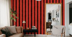 a living room with red and black striped walls