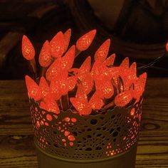 red lights are placed in a basket on a table