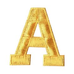 an embroidered gold letter on white background