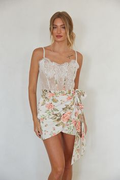 The Mariah Floral Lace Corset Mini Dress is Tea Party worthy. This floral mini dress features a white lace corset bodice, tie wrap skirt, and lace up back. Pair this mini dress with heels to complete the look. Details Self: 70% Cotton, 30% Ramie Contrast: 95% Polyester, 5% Spandex Lining: 70% Cotton, 30% Ramie Adjustab Flirty Lace Mini Dress With Lace Bodice, Summer Lace Corset Dress For Date Night, Summer Lace Corset Dress With Lace Patchwork, Summer Lace Patchwork Corset Dress, Fitted Summer Mini Dress With Lace Bodice, Summer Party Corset Dress With Lace Patchwork, Flirty Mini Dress With Lace Bodice, Fitted Mini Dress With Lace Bodice For Summer, Summer Lace Bodice Mini Dress