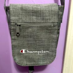 Nwot- Champion Crossbody Shoulder Bag. Light Grey With Pink Buckles/Strap Holders And Blue Interior. Strap Is Adjustable So You Can Wear As A Shoulder Bag Or Crossbody. Approximately: 7.5” Tall, 7.5” Across And 2.2” From Front To Back Champion Crossbody Bag, Blue Interior, Bag Light, Crossbody Shoulder Bag, Blue Gray, Blue Grey, Light Grey, Shoulder Bag, Grey