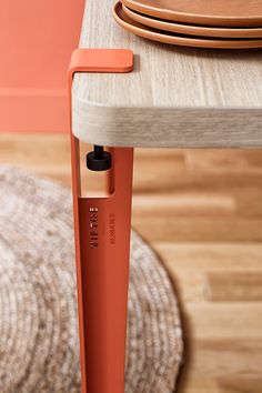 an orange object sitting on top of a wooden table