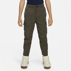 These cargo pants are made of smooth woven fabric enhanced with a water repellent finish that will help keep kids dry in light rains. They have a slightly tapered leg for a more tailored look and an encased elastic waistband, zip fly and snap closure provides a comfy fit. And with multiple spacious pockets, they'll have plenty of space to stash small items. Functional Nike Cargo Pants With Pockets, Nike Functional Bottoms With Cargo Pockets, Nike Functional Cargo Pants With Side Pockets, Nike Functional Cargo Pants With Pockets, Nike Sporty Cargo Pants For Outdoor, Nike Utility Cargo Pants With Side Pockets, Nike Cotton Cargo Pants For Outdoor, Nike Utility Cargo Pants, Nike Utility Pants With Side Pockets