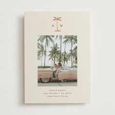 a wedding album with an image of a couple sitting in a car on the beach