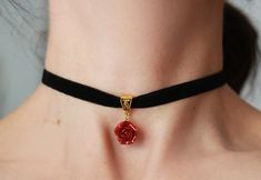 "Black velvet ribbon choker with sculpted ruby-red sparkle rose. Material of rose is polymer clay with special cover Each petal of flower made by hand Dia flower about 15 mm/ 0.55 \" Length of necklace is adjustable: 10-12 inches/ 25,4 - 30,5 cm 11-13 inches/ 28-33 cm 12-14 inches/ 30.5- 35.5 cm 13-15 inches/ 33-38 cm 14-16 inches/ 35.5 cm-40.5 cm 15-17 inches/ 38,1 cm- 43,2 cm 16-18 inches/ 40.6 cm- 45.7 cm 17-19 inches/ 43 cm - 48 cm 18-20 inches/ 45,5- 50.8 cm Width of ribbon 10 mm / 0.4 inch Rose Jewelry For Valentine's Day Party, Valentine's Day Rose-colored Party Jewelry, Valentine's Day Rose Design Party Jewelry, Elegant Rose Design Jewelry Choker, Elegant Rose Design Choker Jewelry, Elegant Rose Design Choker, Rose Red Jewelry With Rose Design For Party, Elegant Rose Choker For Party, Elegant Adjustable Rose Design Choker