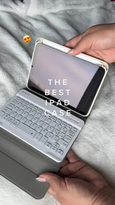 a person holding an open laptop computer on top of a white blanket with the words, the best ipad case