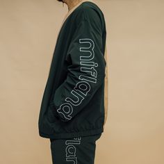 Green/White 100% Nylon Full Zip Track Jacket. Color Blocked with front chest and center back patch. True to size TERMS & CONDITIONS Back Patch, Track Jacket, Track Jackets, Design Company, Color Block, Track, Green, White, Color